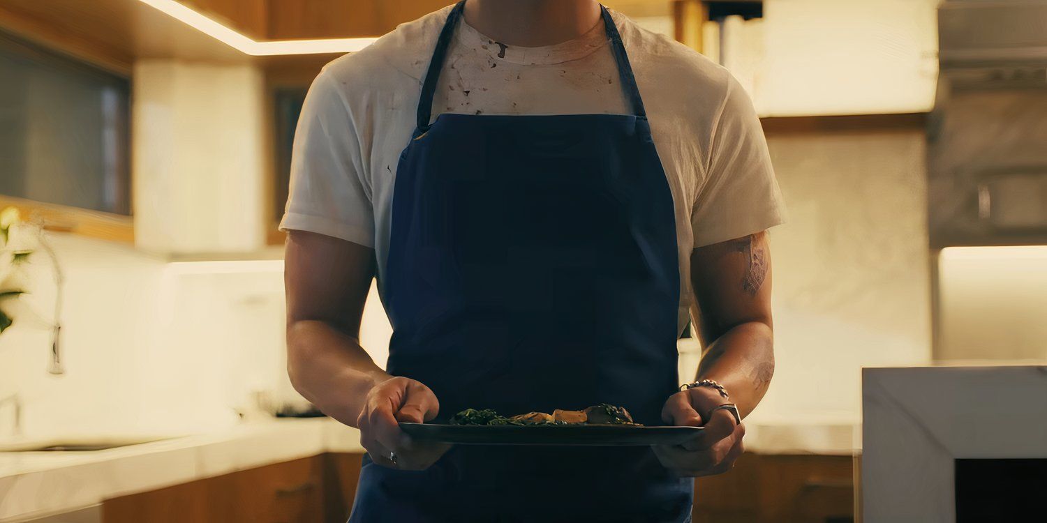 Lukas Gage as Patrick holding a plate of food in Companion