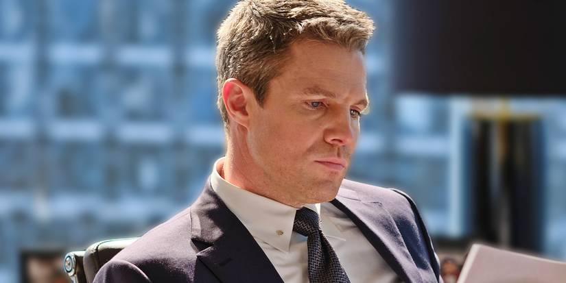 Stephen Amell looking aggrieved in his office in Suits LA