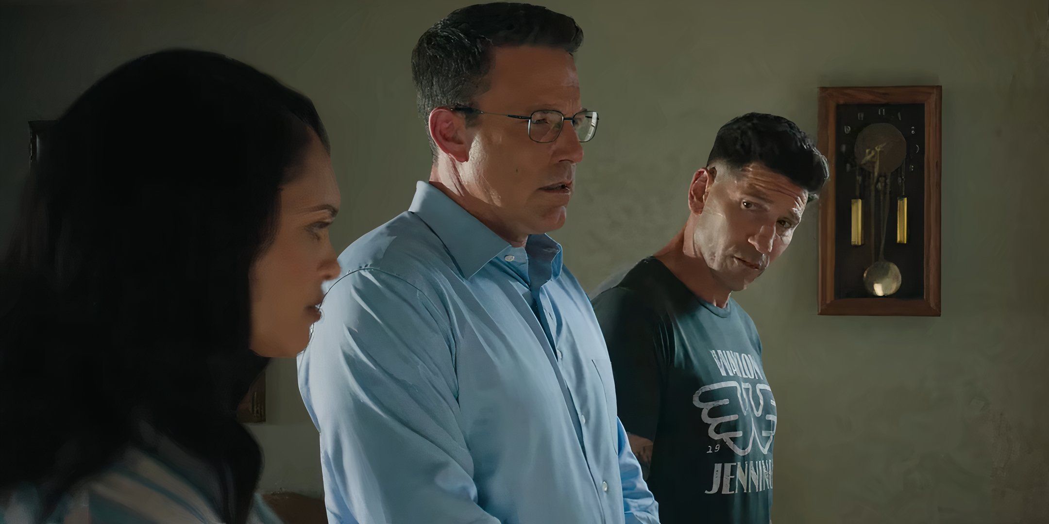 Cynthia Addai-Robinson's Marybeth, Ben Affleck's Christian and Jon Bernthal's Brax talking to each other in front of the evidence wall in The Accountant 2