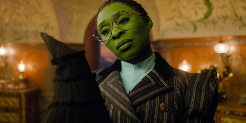 Cynthia Erivo as Elphaba holding her black hat in Wicked