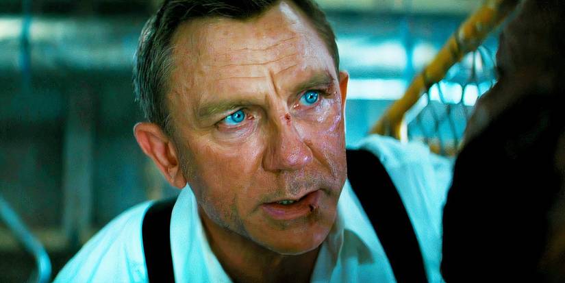 Daniel Craig as James Bond looking sweaty and bruised