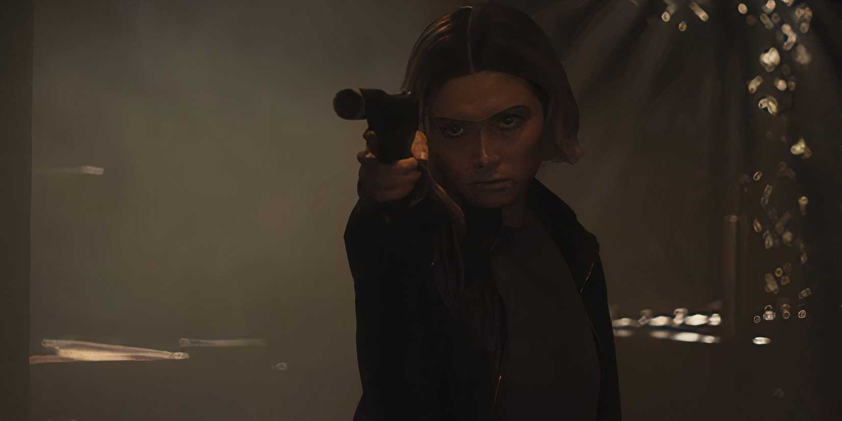 Daniella Pineda aiming a silenced pistol while looking intensely in The Accountant 2