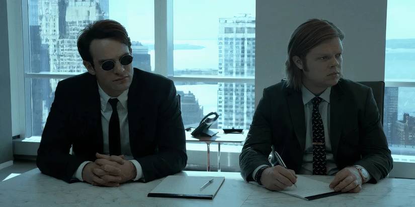 MCU's Matt Murdock and Foggy Nelson sitting together as lawyers in the live-action Daredevil series.