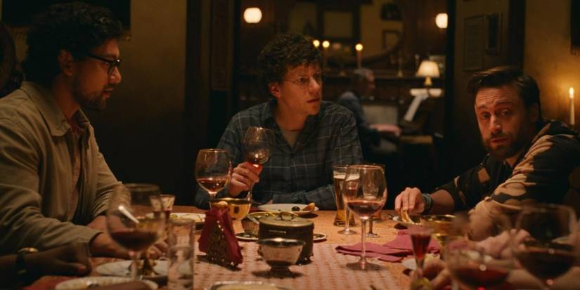 Dave, Benji, and James sit at a dinner table in A Real Pain