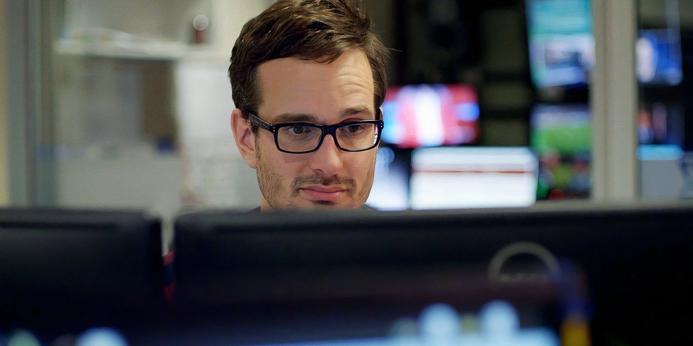 David Farrier at a computer in the Tickled documentary