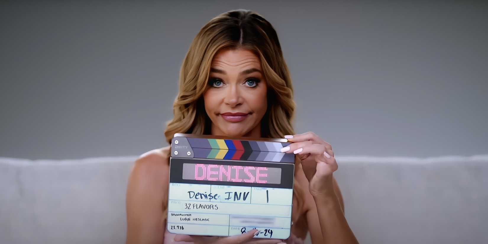 Denise Richards using the slate board to film her confessionals in Denise Richards and Her Wild Things