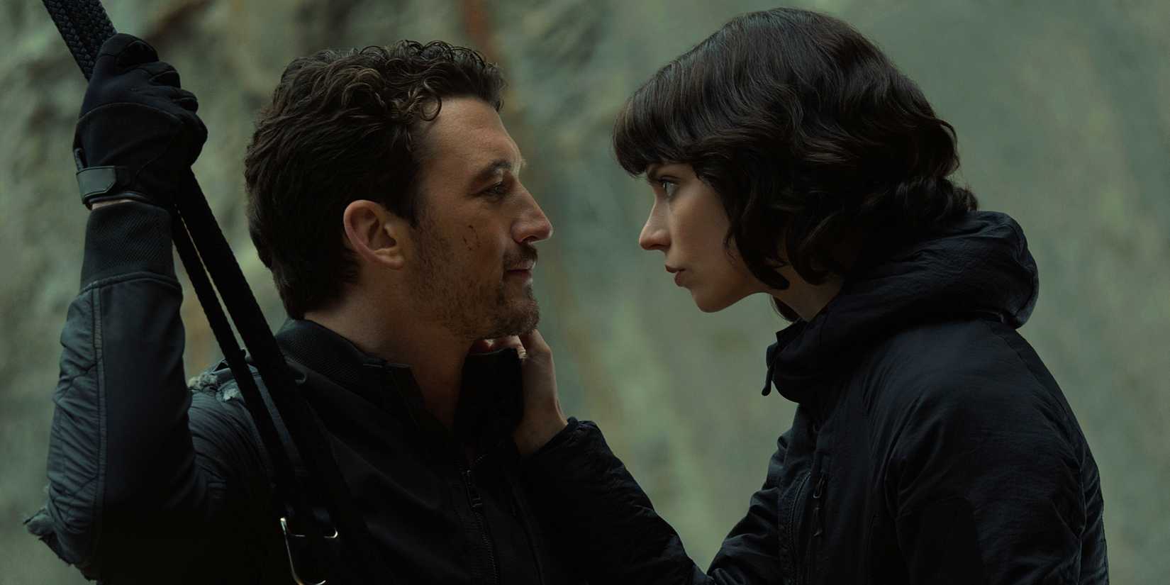 Drasa stares intently at Levi as he gives her a faint smile in The Gorge