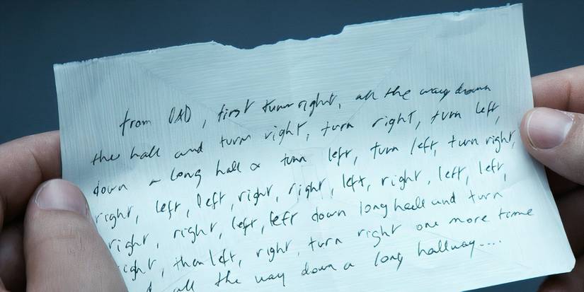 Dylan holding a note in Severance season 2 (2025)