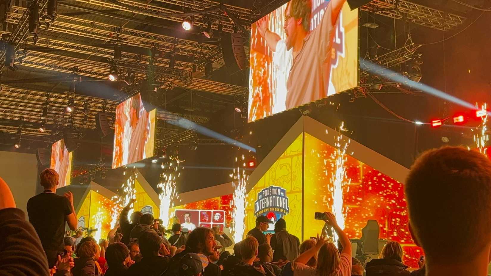 EUIC stage showing Wolfe celebrating his win as pyrotechnics go off around him.