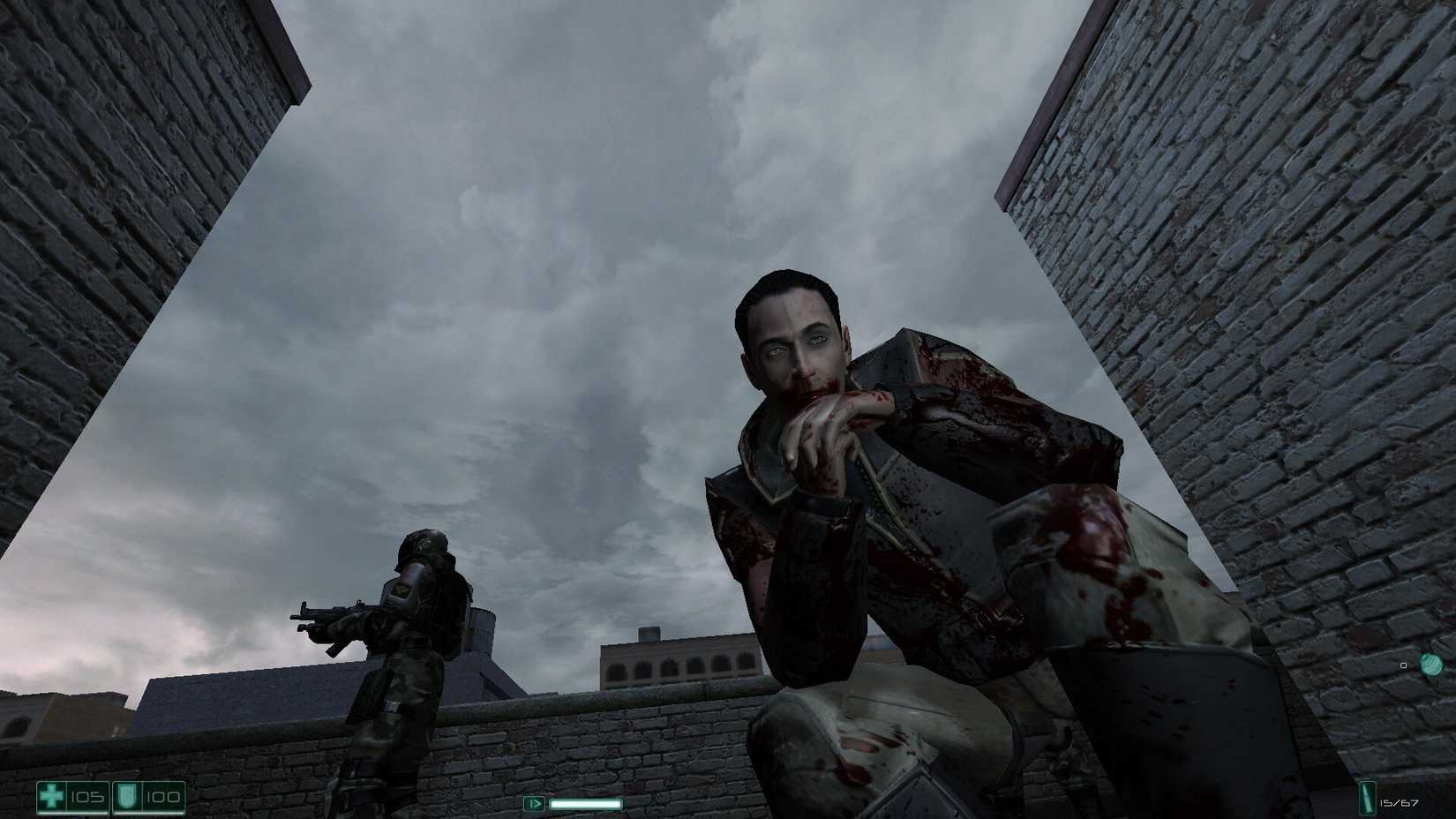 FEAR screenshot of a bloodied man kneeling over the protagonist