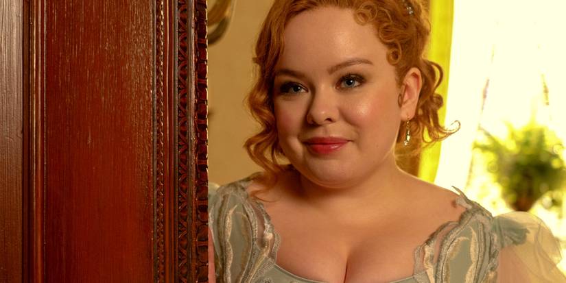 Nicola Coughlan as Penelope Featherington standing in a doorway in Bridgerton