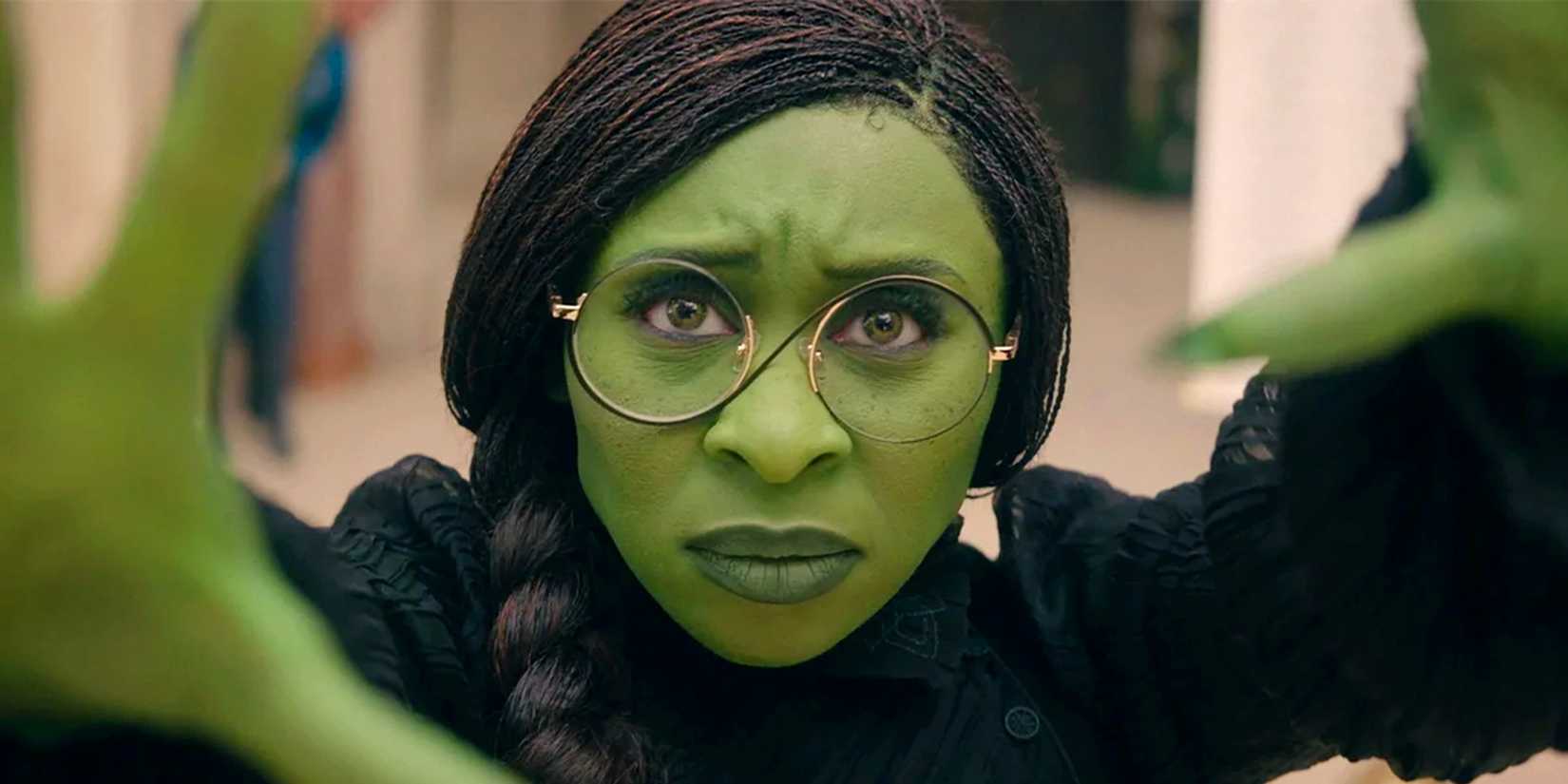 Cynthing Erivo holding her hands out as Elphaba in Wicked Part 1 (2024)