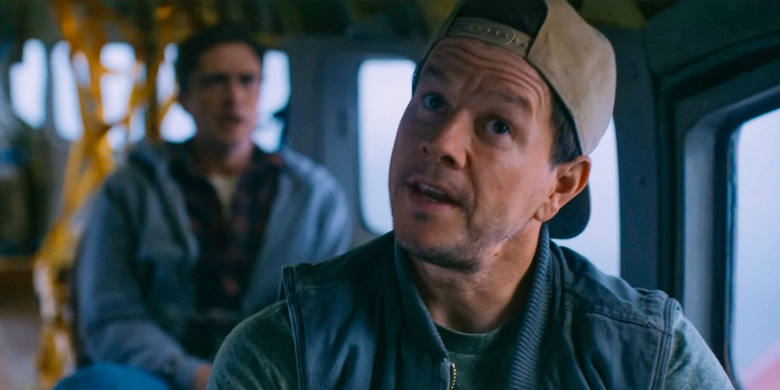 Daryl (Mark Wahlberg) wearing an ironic expression while piloting the plane in Flight Risk