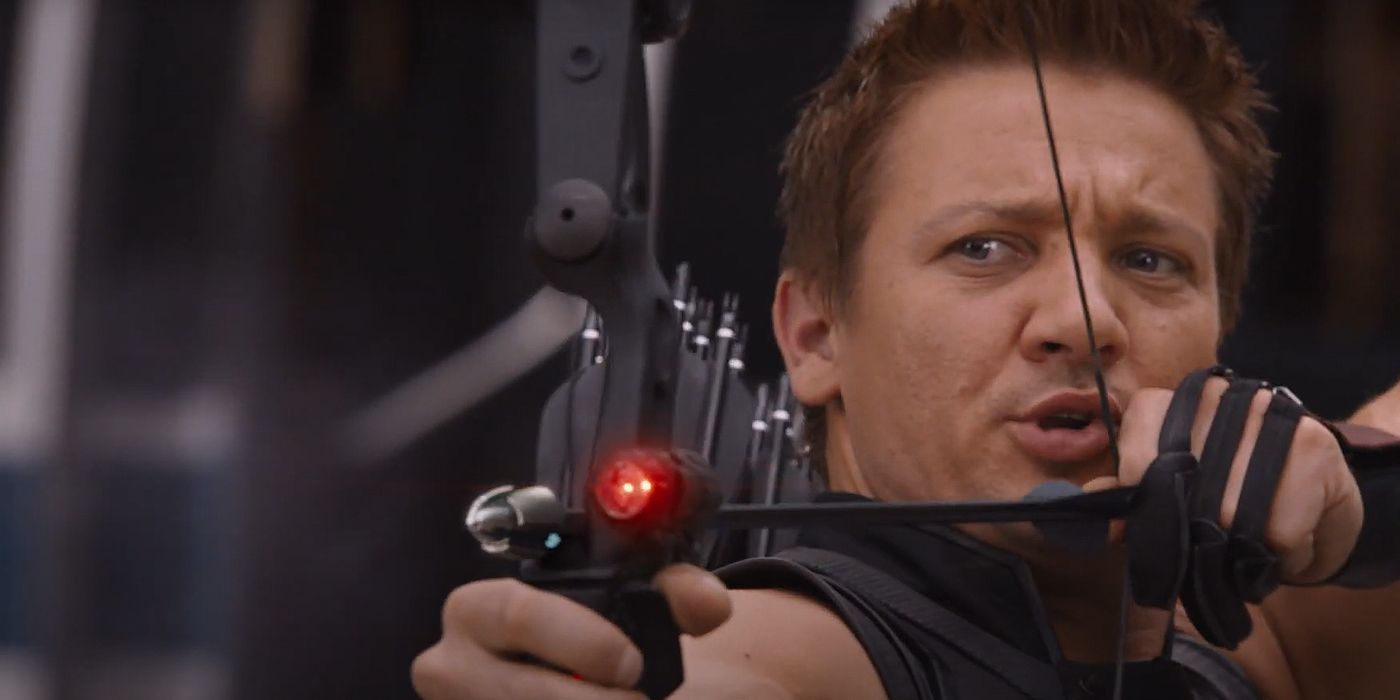 Hawkeye taking aim at someone with his bow and arrow while talking to Black Widow in The Avengers