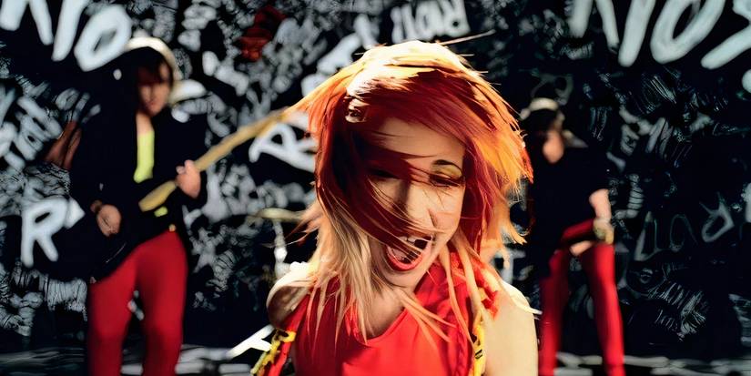 Hayley Williams singing in Paramore's Misery Business music video