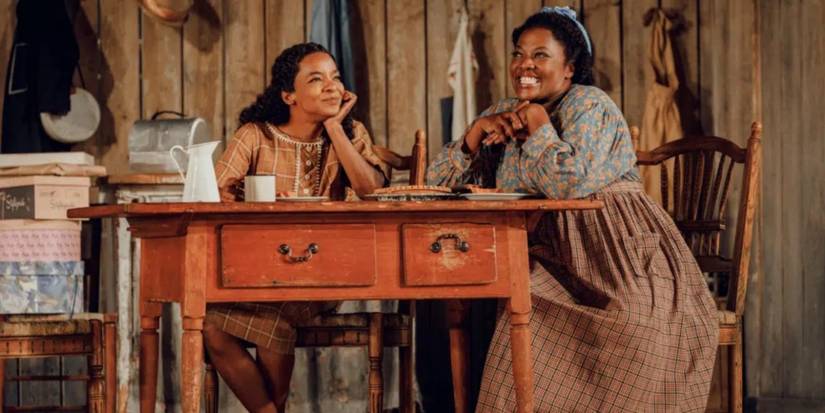 heather Alicia Simms (l) on the set of a play