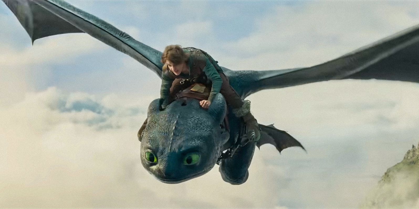 Hiccup (Mason Thames) riding Toothless in How To Train Your Dragon (2025)