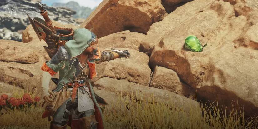 Monster Hunter Wilds hunter using their Slinger to collect a material from the world