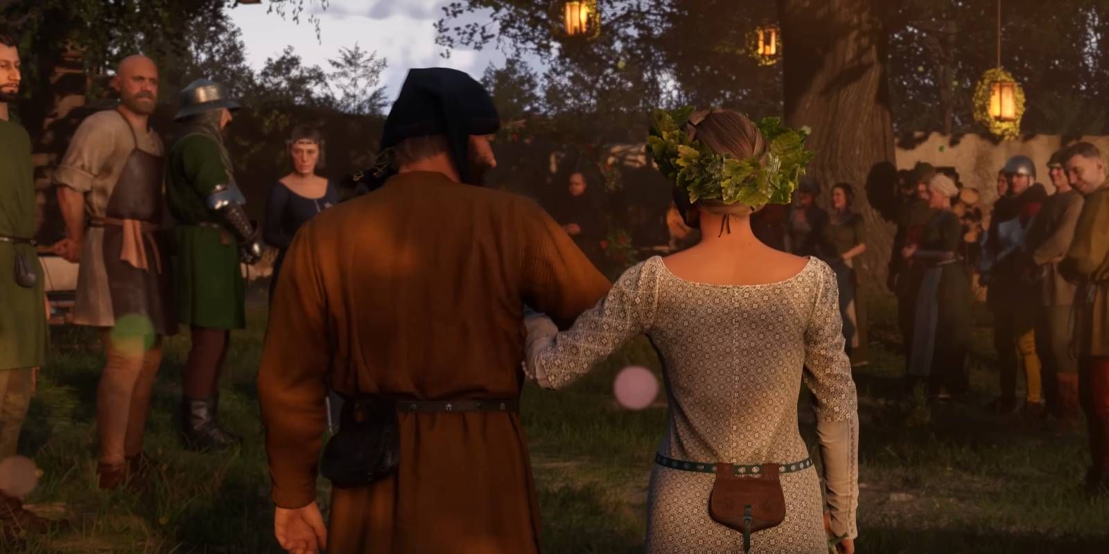 Kingdom Come: Deliverance 2 two characters getting married with friends/family surrounding them
