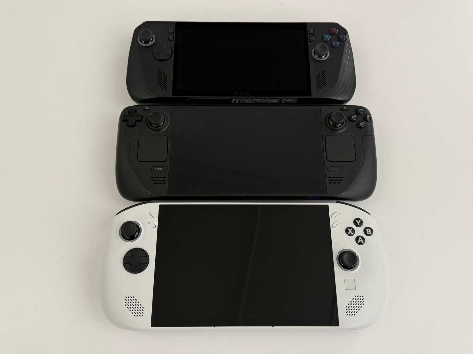 Lenovo Legion S Handheld face-up, compared to other handhelds, on a white background