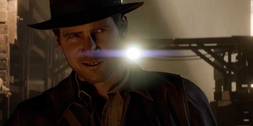 Indiana Jones from a cutscene in Indiana Jones and the Great Circle standing in front of a light. 