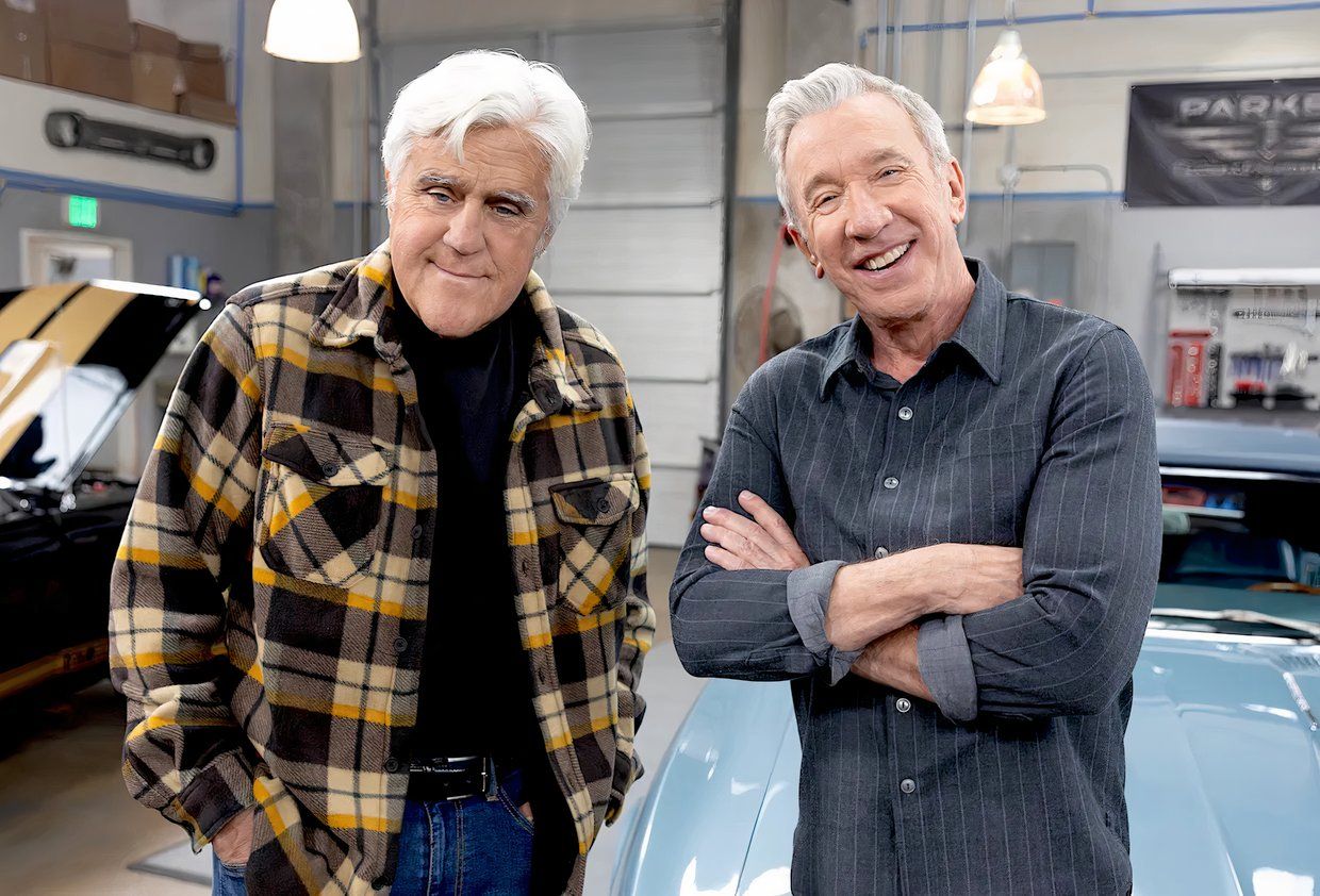 Leno and Allen stand side by side in Allen's autorepair shop for Shifting Gears