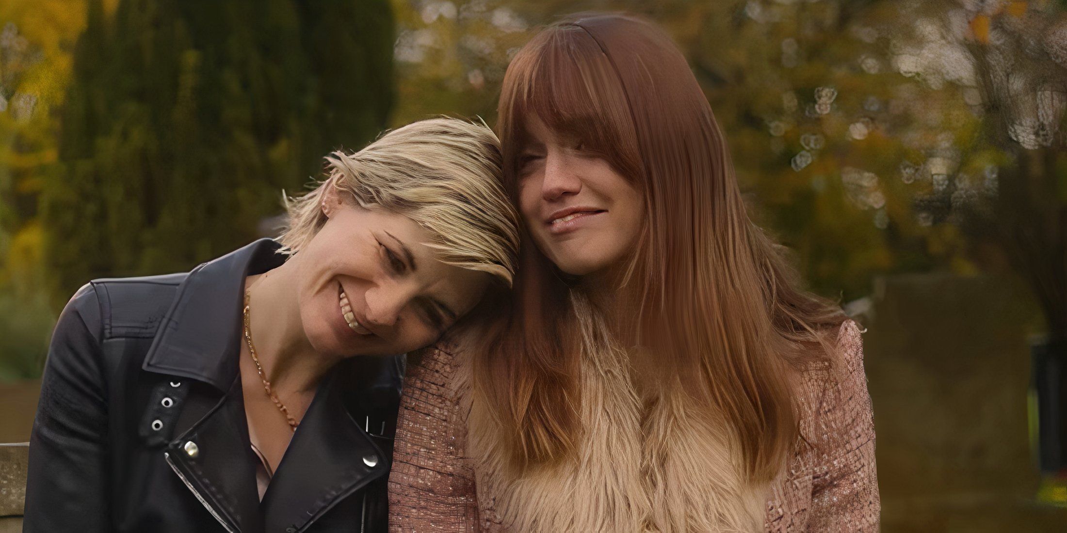 Jodie Whittaker as Susan McIntyre next to Aimee Lou Wood as Tracey Taylor on a bench together in Toxic Town