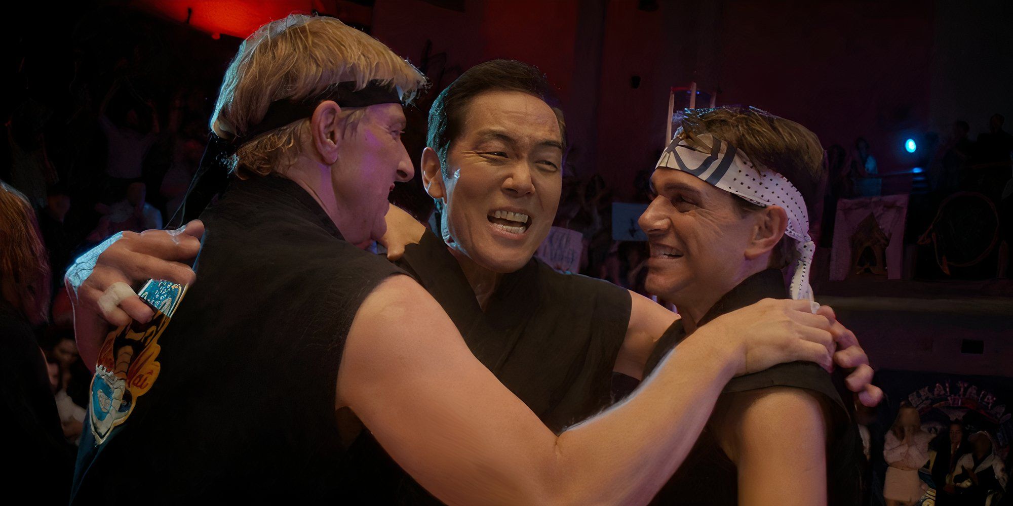 Johnny, Chozen and Daniel celebrating in Cobra Kai.