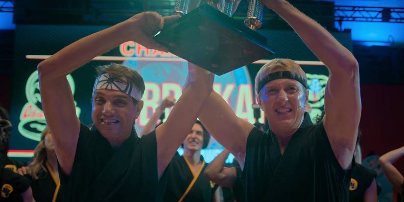 Johnny and Daniel holding the Sekai Taikai trophy in Cobra Kai season 6, part 3 (2025)