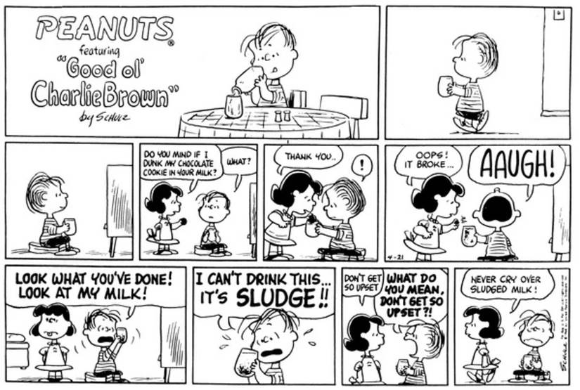 Sally dropping her cookie in Linus's milk.