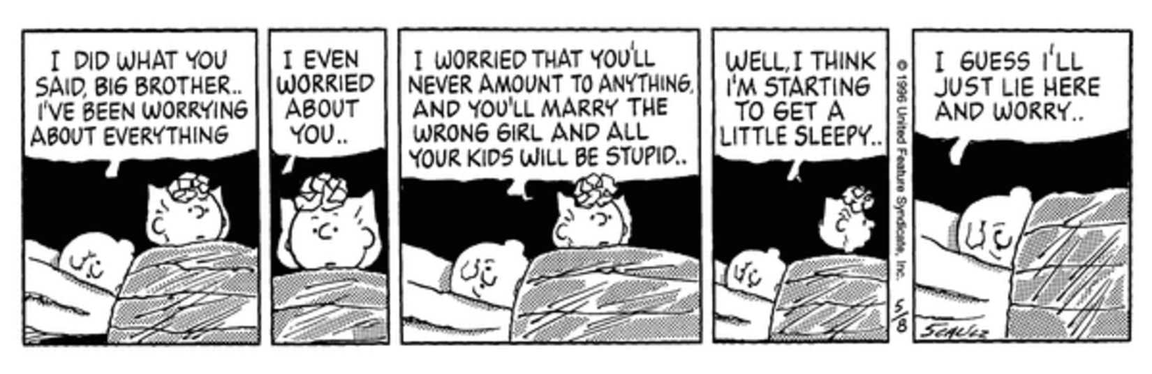 Sally waking up Charlie Brown at night in bed.