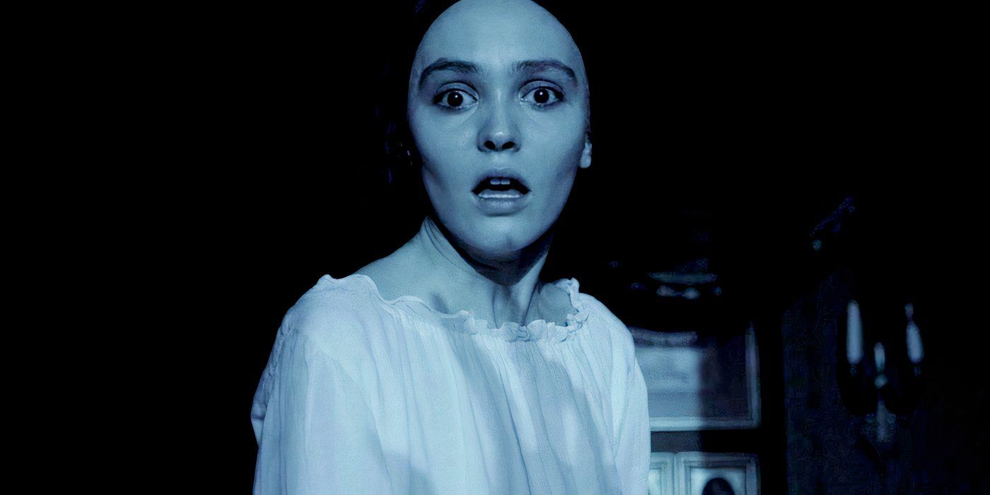 Lily Rose Depp gasping with a shadow of a hand on her torso in Nosferatu 2024