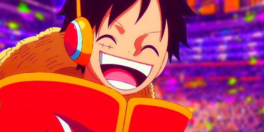 Luffy smiling in his Egghead outfit. Behind him, the Lakers court can be seen.