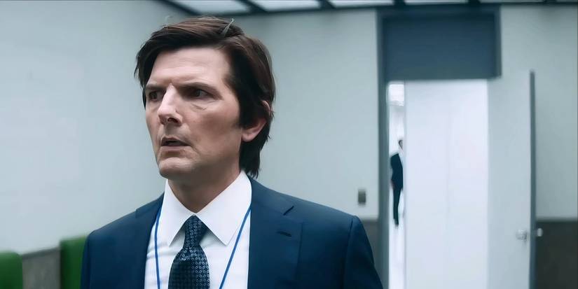Mark (Adam Scott) and the mysterious man behind him in Severance