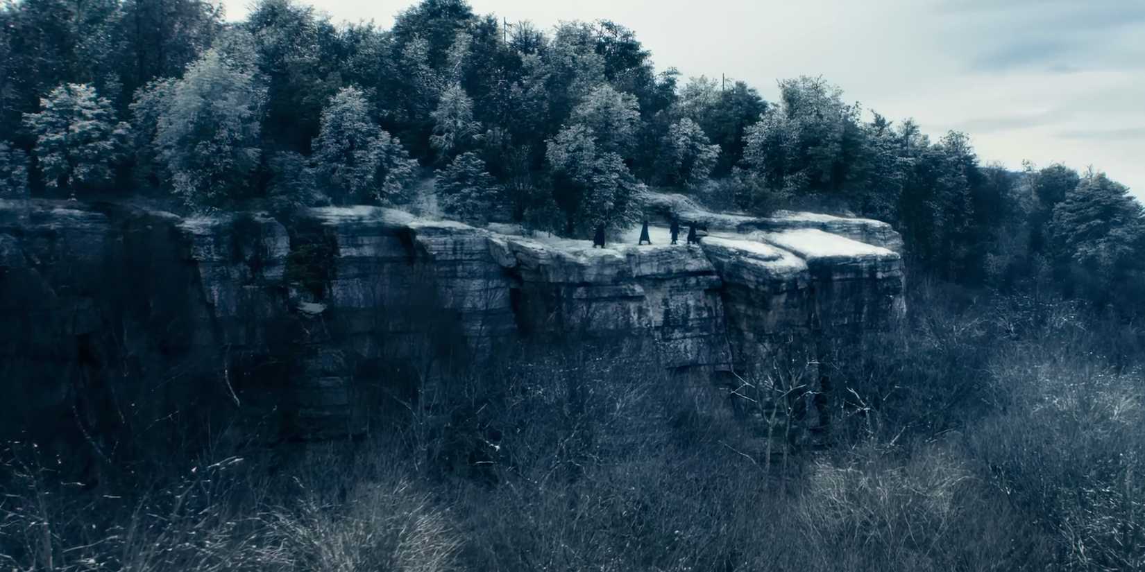Mark, Dylan, Helly, and Irving walking on a snowy cliff in Severance season 2 episode 4