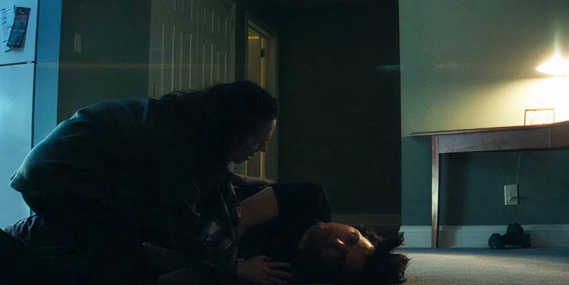 Devon squatting over Mark's body while he has a seizure in Severance season 2, episode 6 (2025)