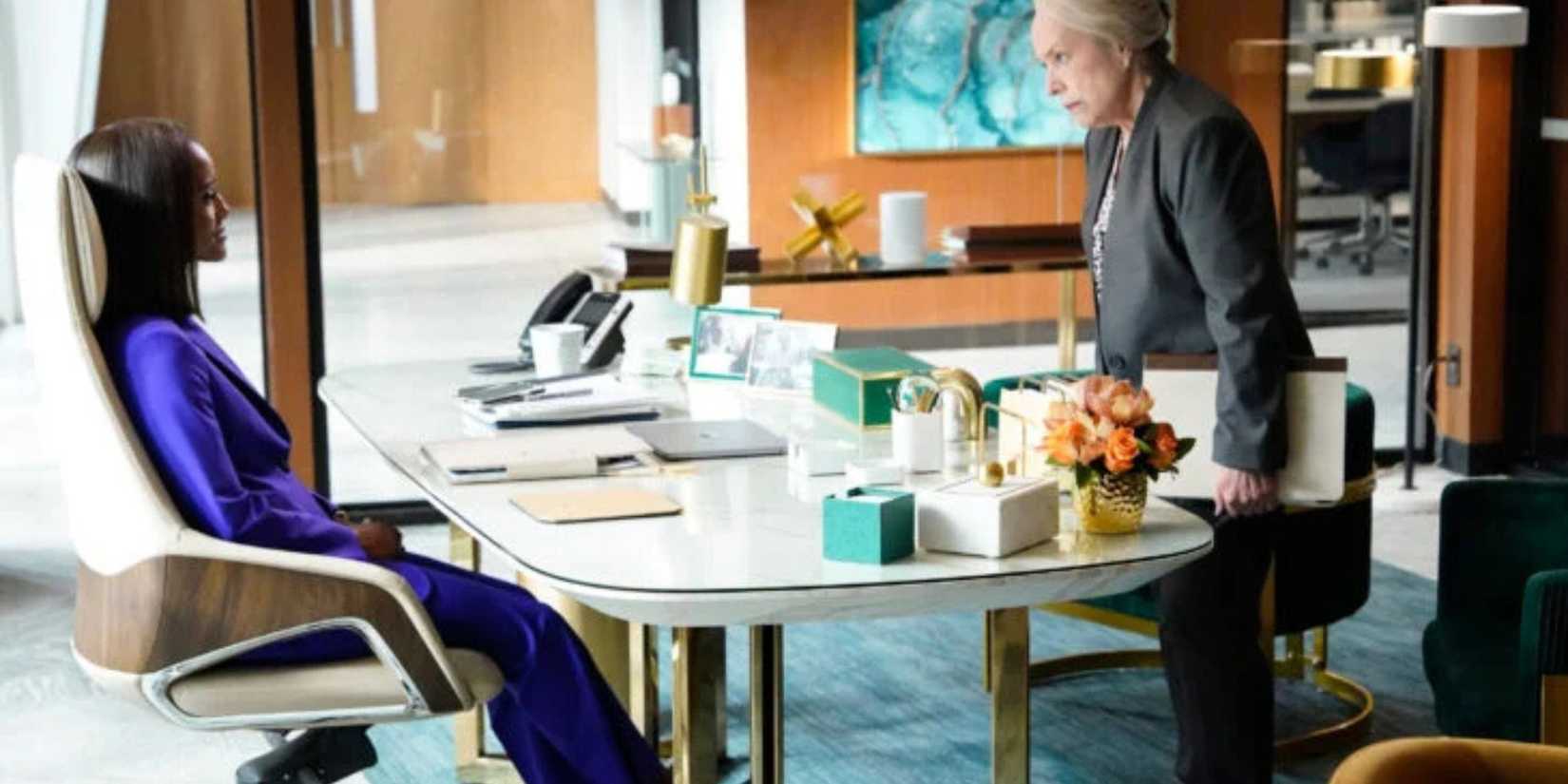 Matlock Madeline standing in front of Olympia's desk while Olympia sits behind it 