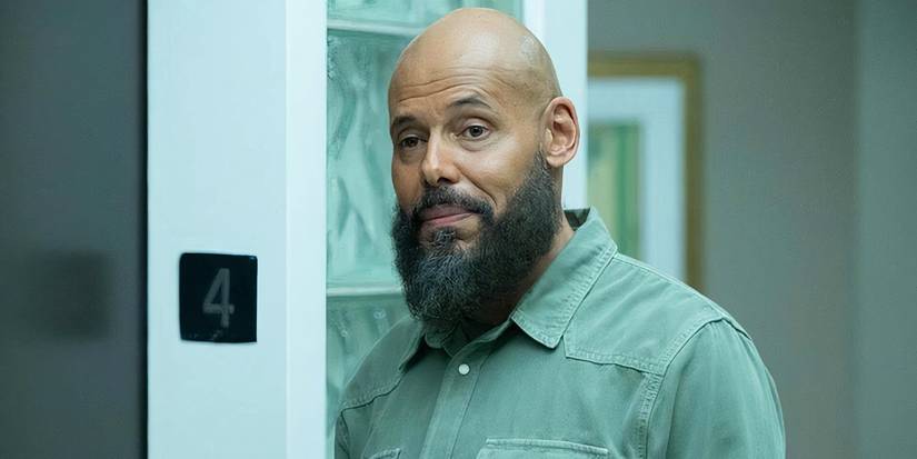 Maurice Dean Wint as August Ripley by an elevator in SurrealEstate