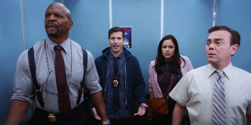Melissa Fumero as Amy Santiago, Andy Samberg as Jake Peraltam, Joe Lo Truglio as Charles Boyle, and Terry Crews as Terry Jeffords in an elevator on Brooklyn Nine-Nine