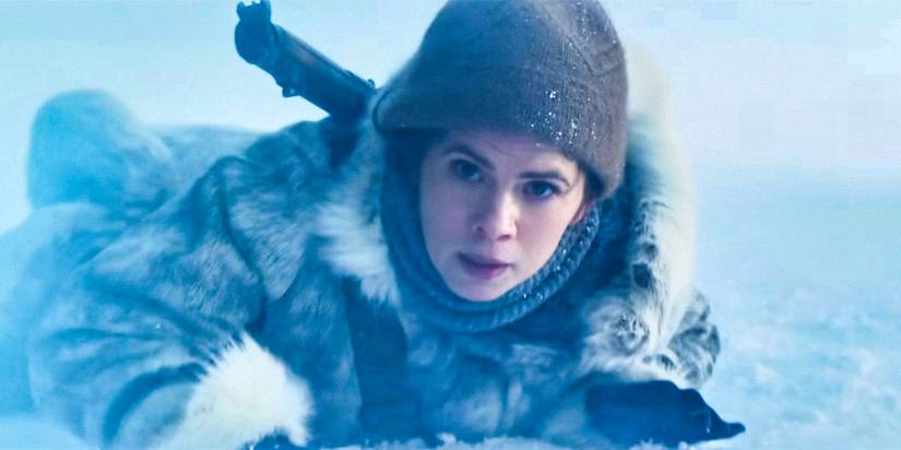 Grace (Hayley Atwell) lying chest-first on the ground in a blizzard in Mission: Impossible - The Final Reckoning