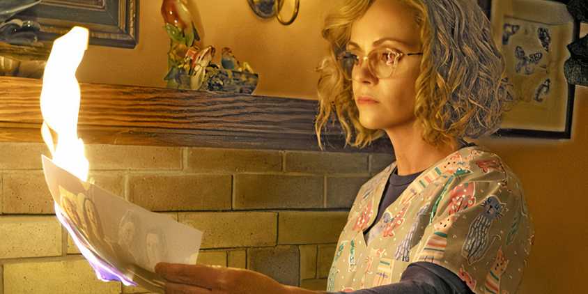 Misty burns a photo of her and the other survivors in Yellowjackets season 3, episode 3