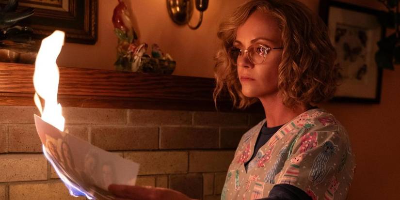 Misty lighting a picure on fire in Yellowjackets season 3, episode 3