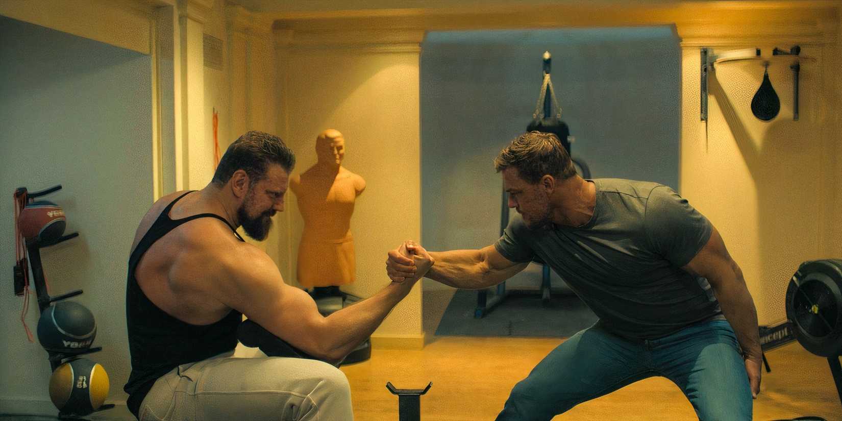 Reacher and Paulie arm wrestle in Reacher