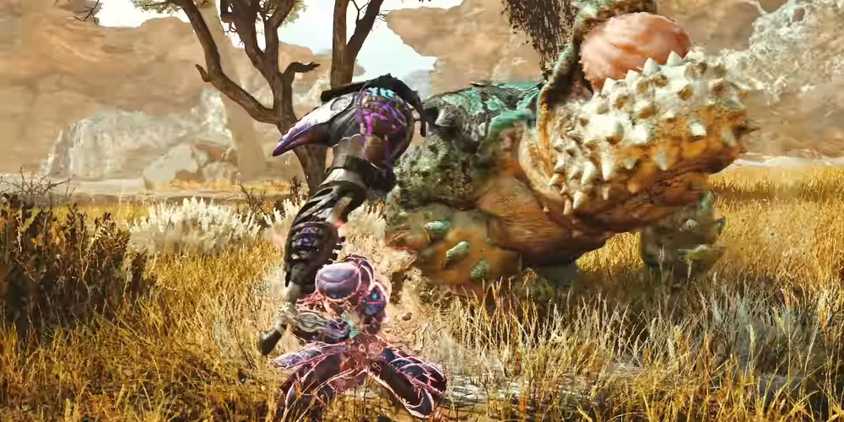 A hunter from Monster Hunter Wilds fights a monster with a Hammer.
