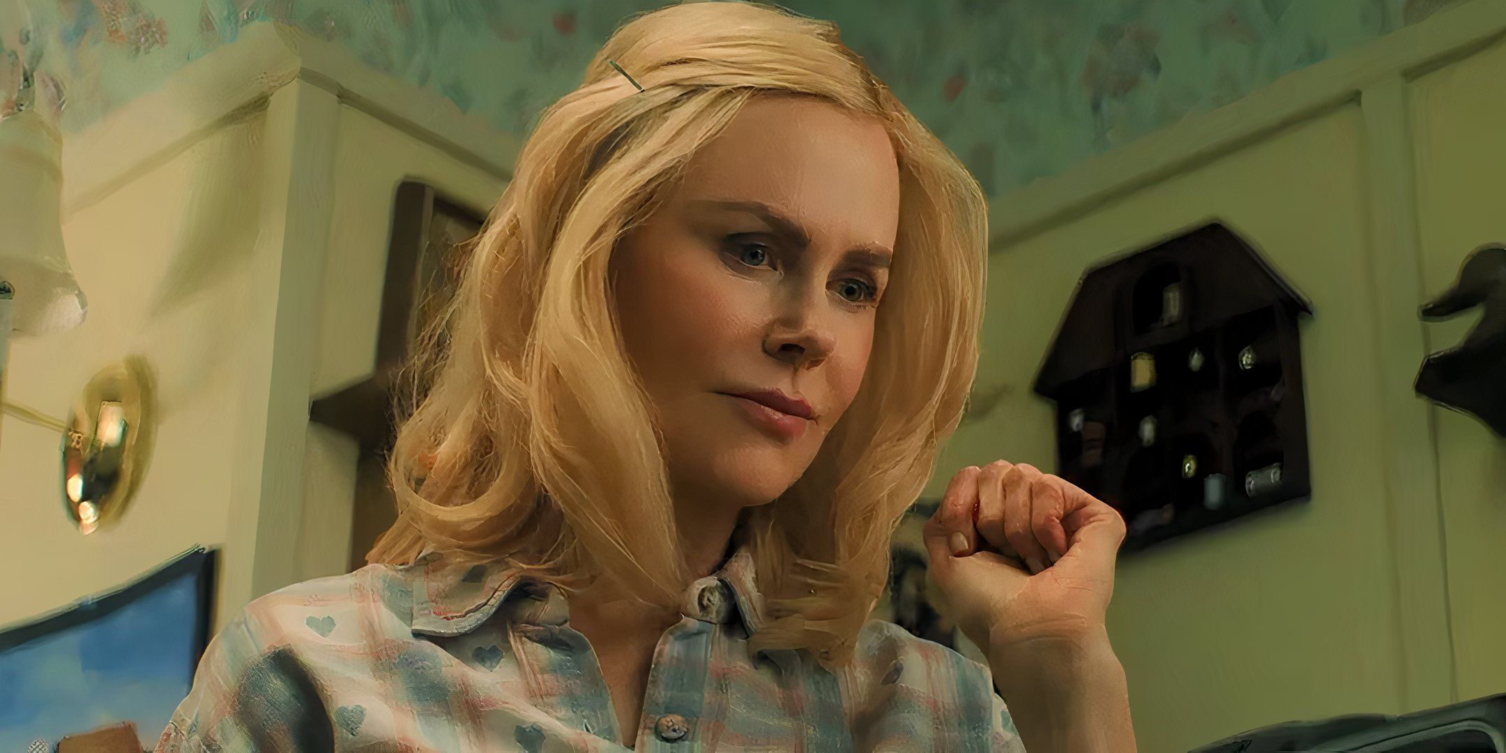 Nicole Kidman's Nancy looking curiously at something in Holland