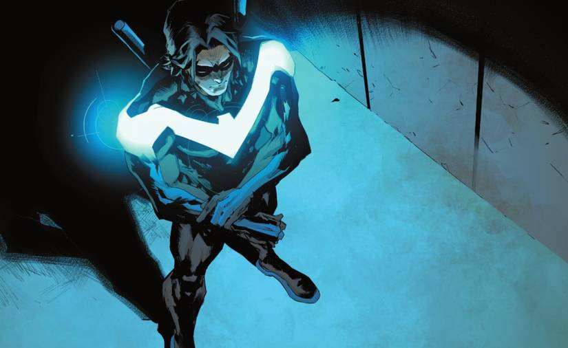 Nightwing's costume glows in the dark and lights up a dark corridor