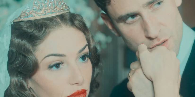 Oliver Jackson Cohen as Neville posing for a photo with his new wife in Towards Zero