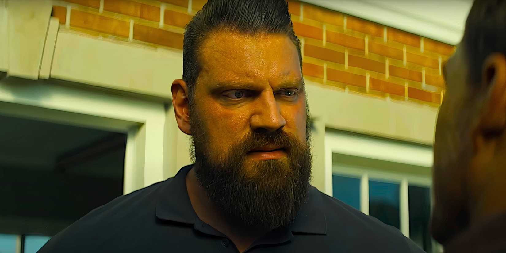 Olivier Richters stares down Alan Ritchson in a scene from Reacher season 3