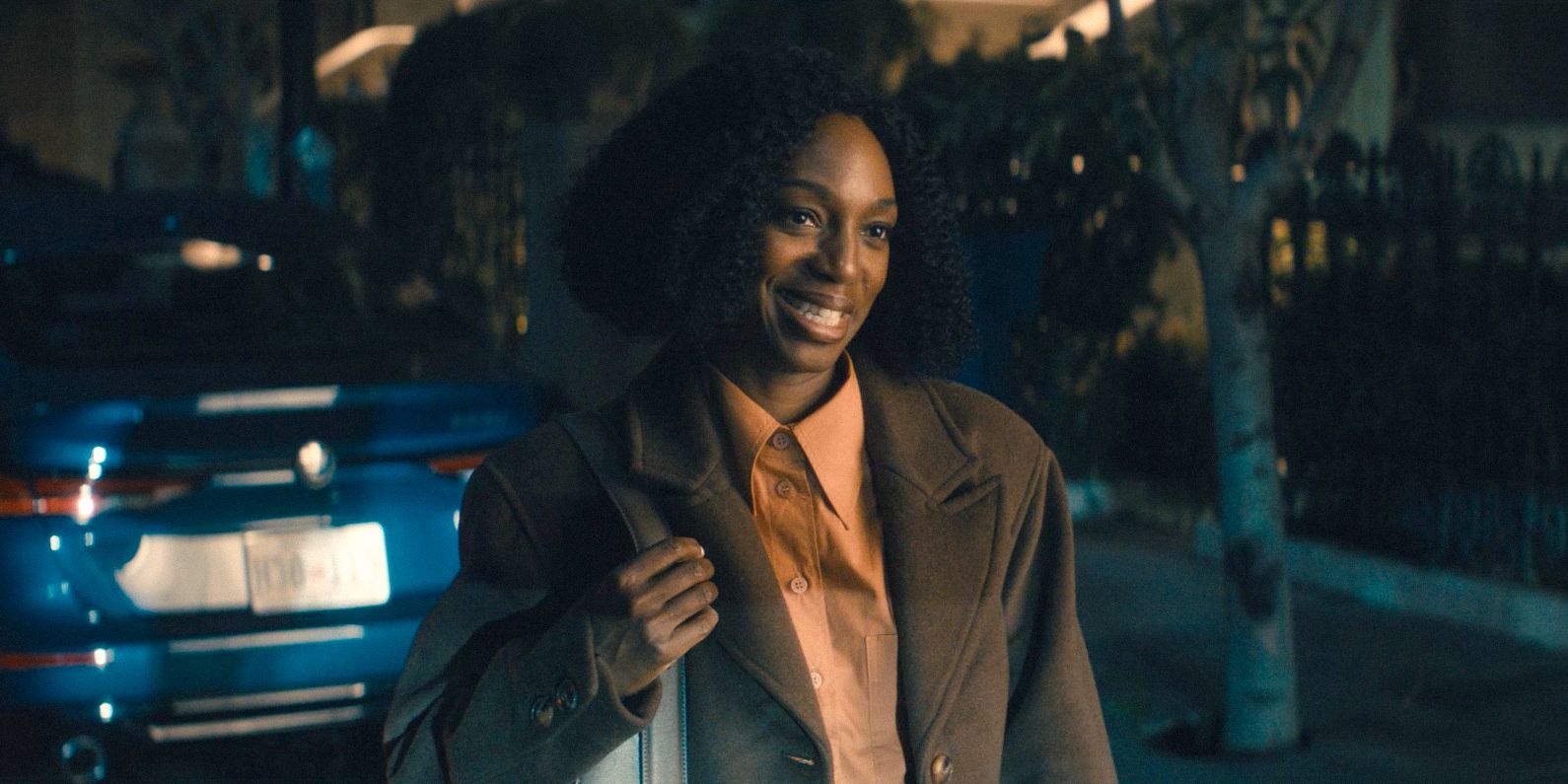 Teri Collins (Enuka Okuma) smiling in Paradise (2025) Season 1 Ep 6