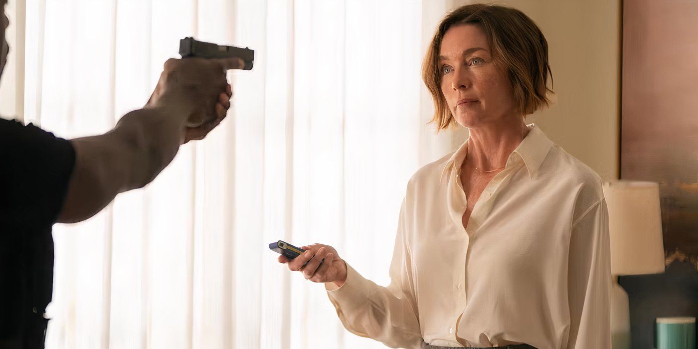 Xavier Collins (Sterling K. Brown) pointing a gun at Sinatra (Julianne Nicholson) in Paradise